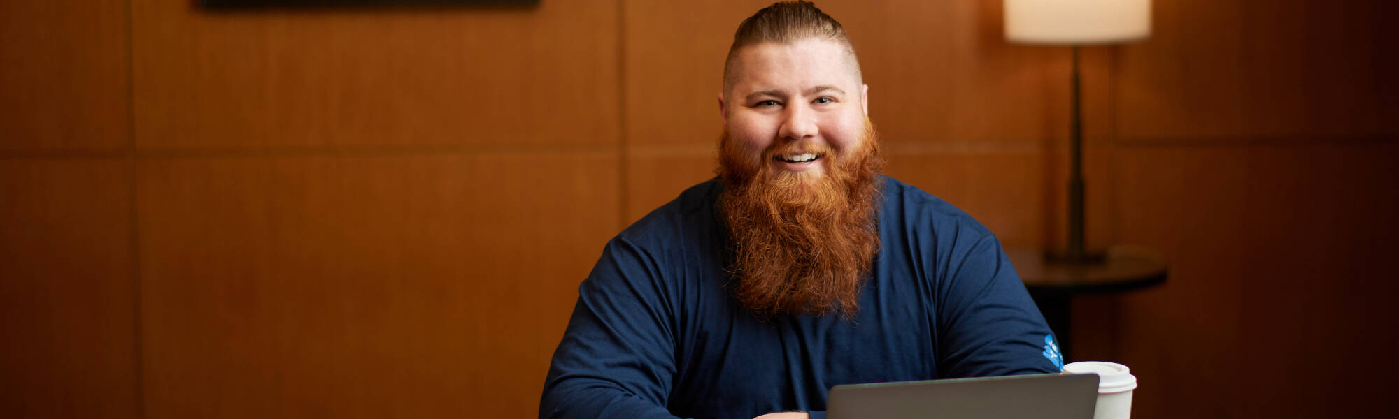 GVSU adult student working in an office.